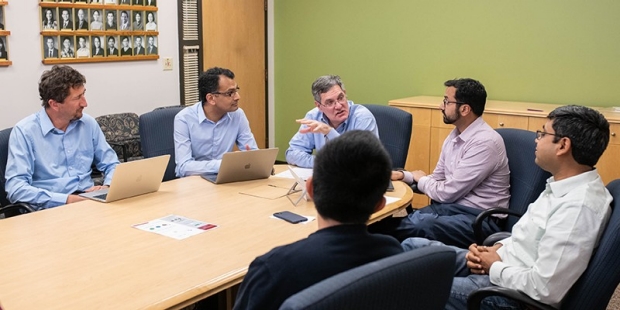 Group of people having a discussion in a conference room